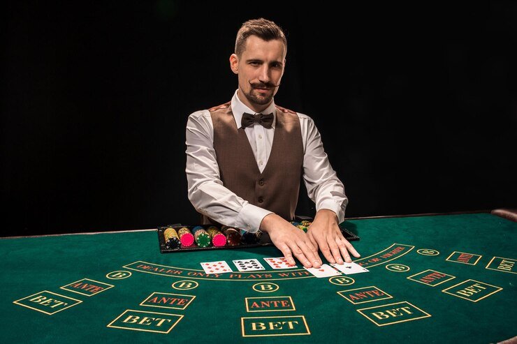 Three Card Poker live dealer di studio sportsbet dengan tampilan kartu dan chip